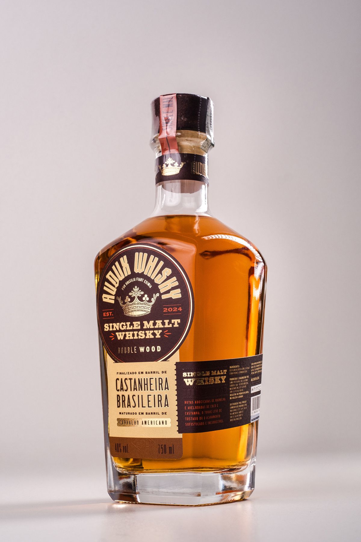 Audux Whisky single malt bottle with crown emblem label